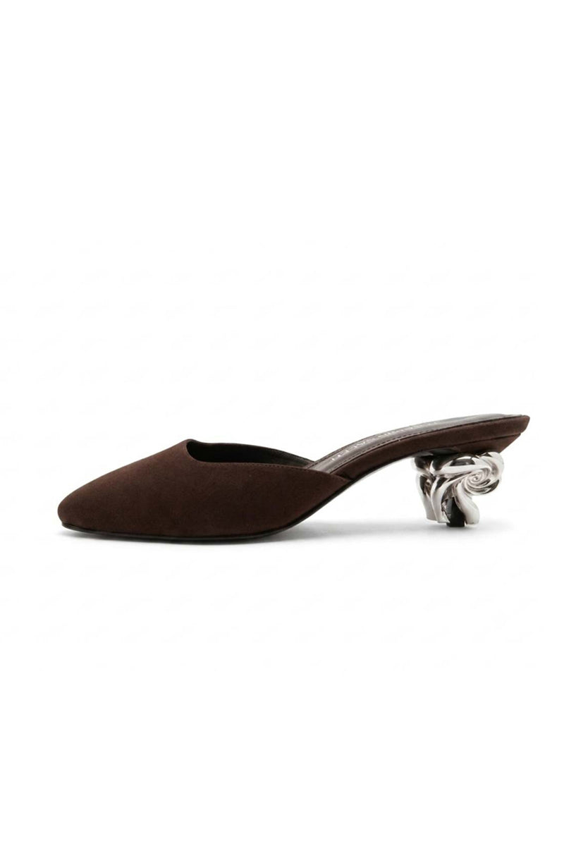 YASSMIN SALEH Orbit Heels in brown, stylish women's high heels with ankle straps, worn outdoors on a ghostly background.