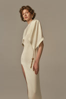 Ivory POEM Maxi Dress displayed on a model, featuring a flowing, elegant design perfect for casual or formal occasions.
