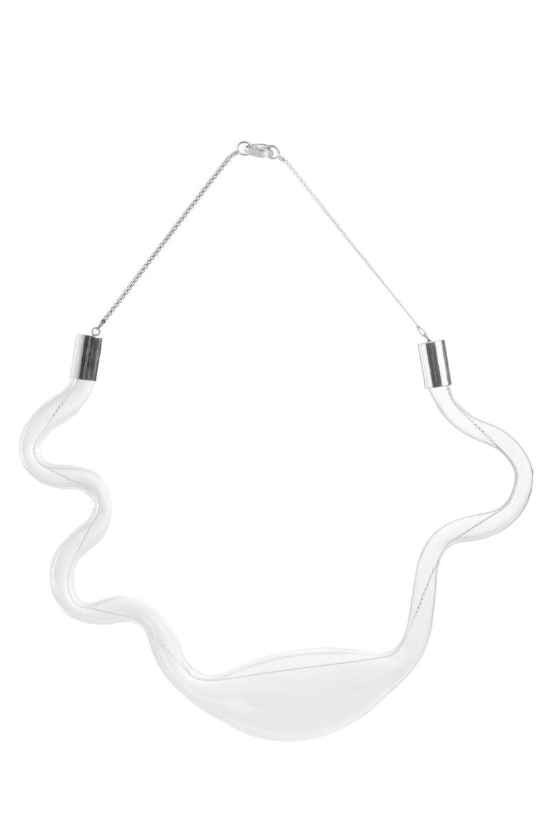 Organic glass necklace by MAZ Manuela Álvarez featuring a sleek, transparent pendant on a delicate chain.