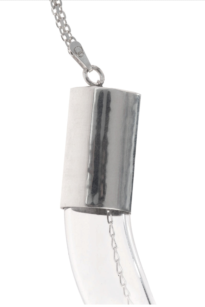 Organic glass necklace by MAZ Manuela Álvarez featuring a sleek, transparent glass pendant on a delicate chain.