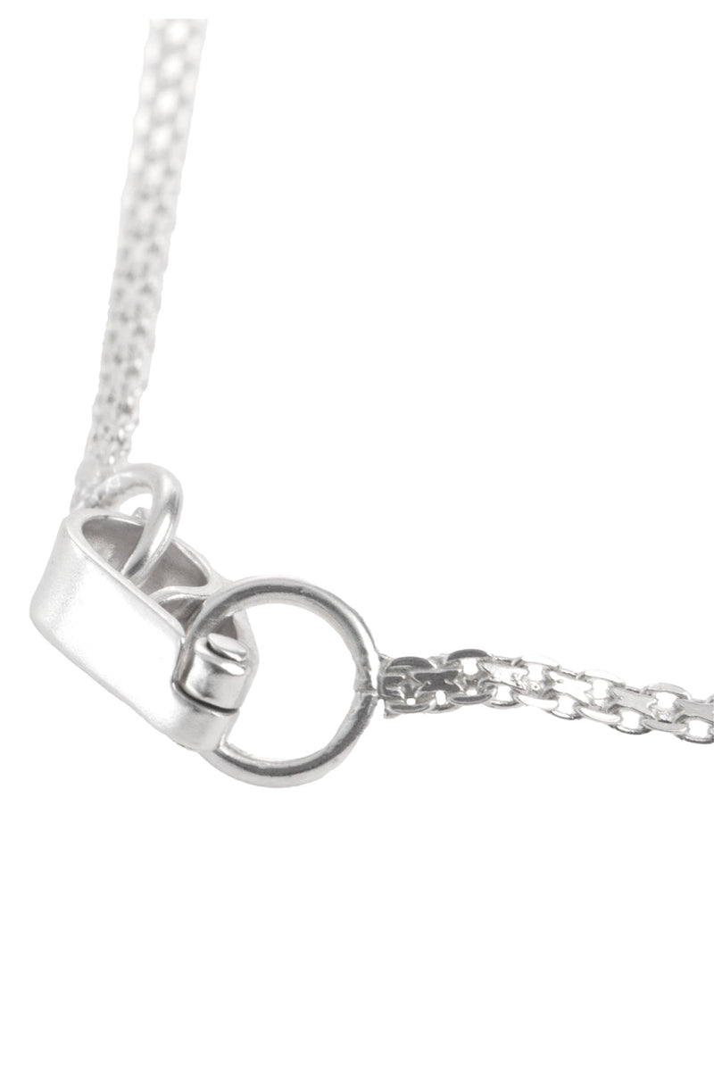 Organic glass necklace by MAZ Manuela Álvarez featuring a sleek, translucent pendant on a delicate chain.