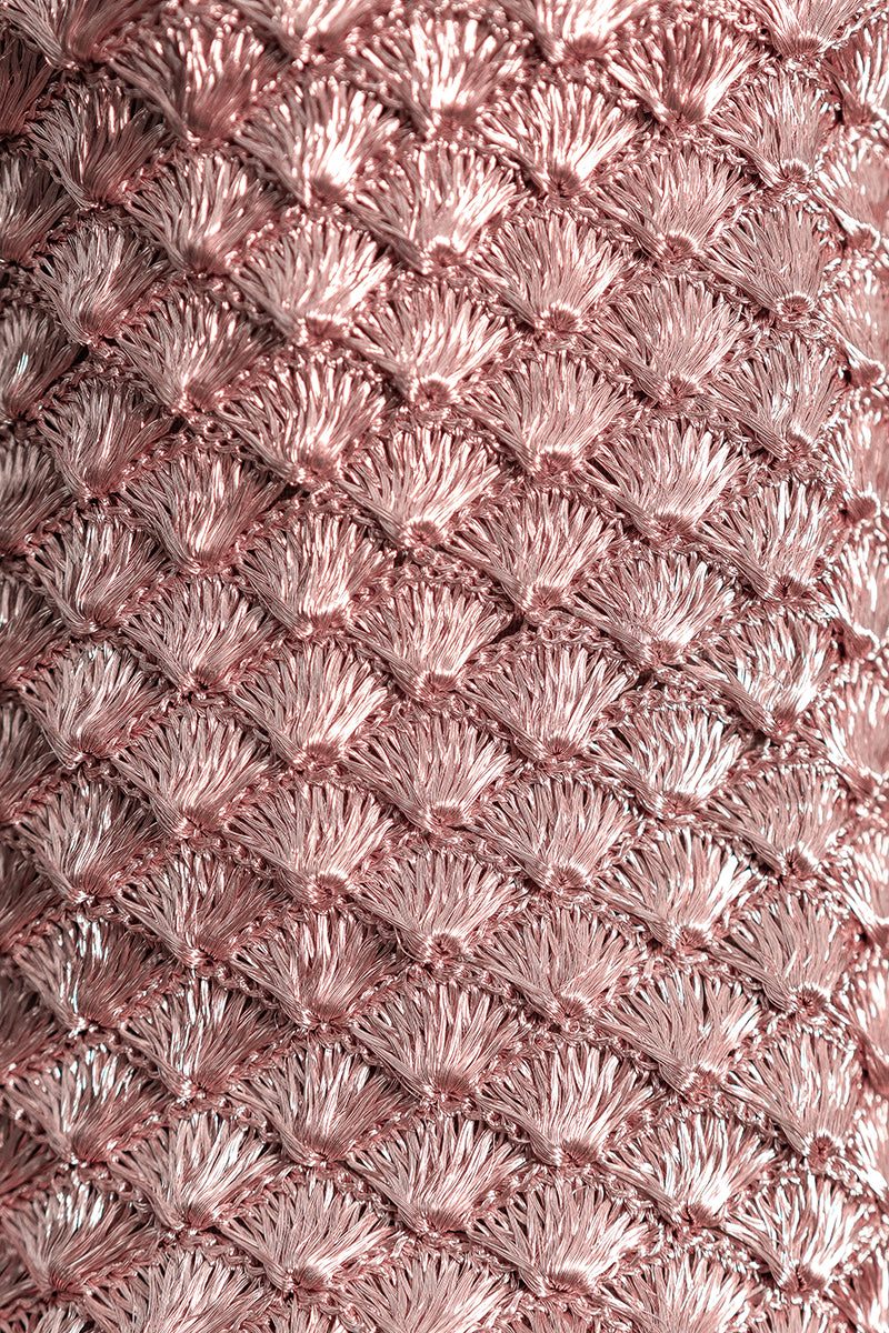 Close-up of VERDI seashell clutch in rose gold with intricate shell details and elegant compact design.
