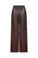 ZUT oversized chocolate crocodile-patterned pants showing relaxed fit and textured fabric in a stylish fashion style