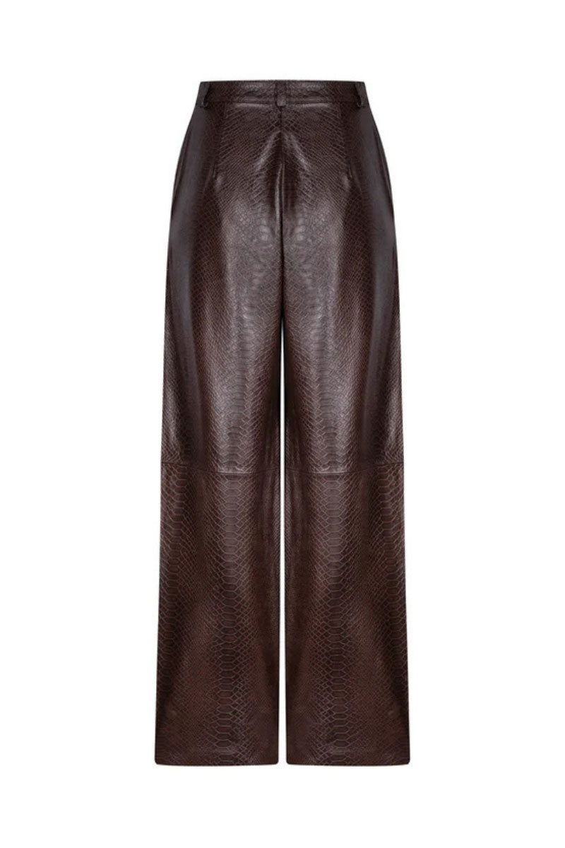 ZUT oversized chocolate croc-embossed pants with a loose fit and textured crocodile pattern, casual streetwear style.
