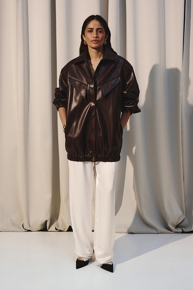 Brown oversized bomber jacket by Kris Marán, shown on a model with a relaxed fit and stylish design.