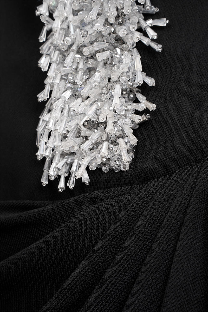 Elegant AZRA gown by EEGEN STUDIO featuring intricate embroidery and flowing fabric, perfect for formal occasions.