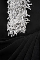 Elegant AZRA gown by EEGEN STUDIO featuring intricate embroidery and flowing fabric, perfect for formal occasions.