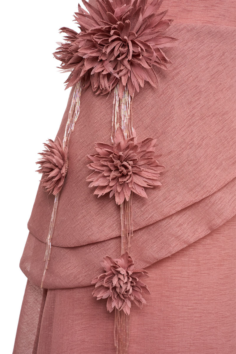 Elegant CYRA gown by EEGEN STUDIO featuring flowing fabric and intricate detailing, displayed on a mannequin.