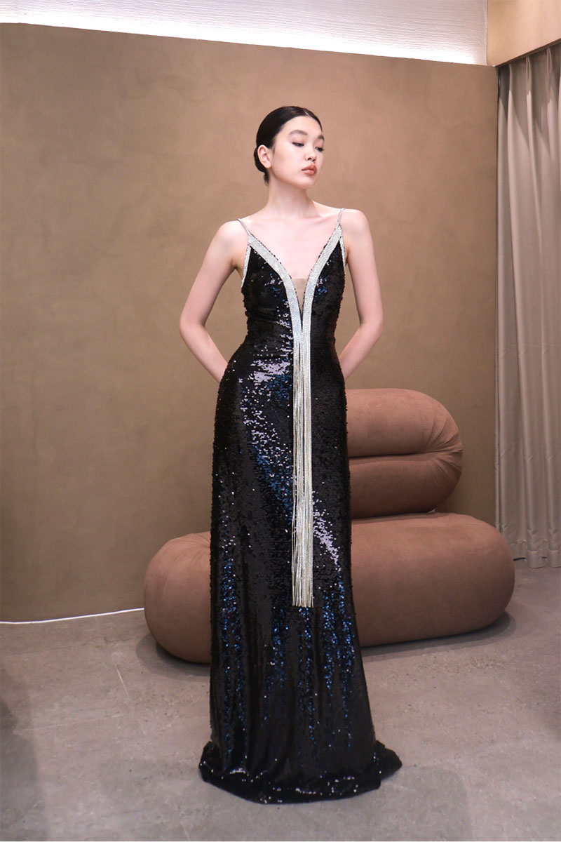 Elegant AZMIRA dress gown by EEGEN STUDIO, featuring flowing fabric and intricate design details in a stylish evening gown.