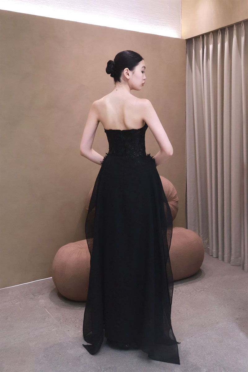 Elegant VESARA gown by EEGEN STUDIO, featuring intricate design details and flowing fabric, perfect for formal occasions.