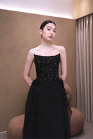 Elegant VESARA gown by EEGEN STUDIO, featuring flowing fabric and intricate design, showcased in this image.