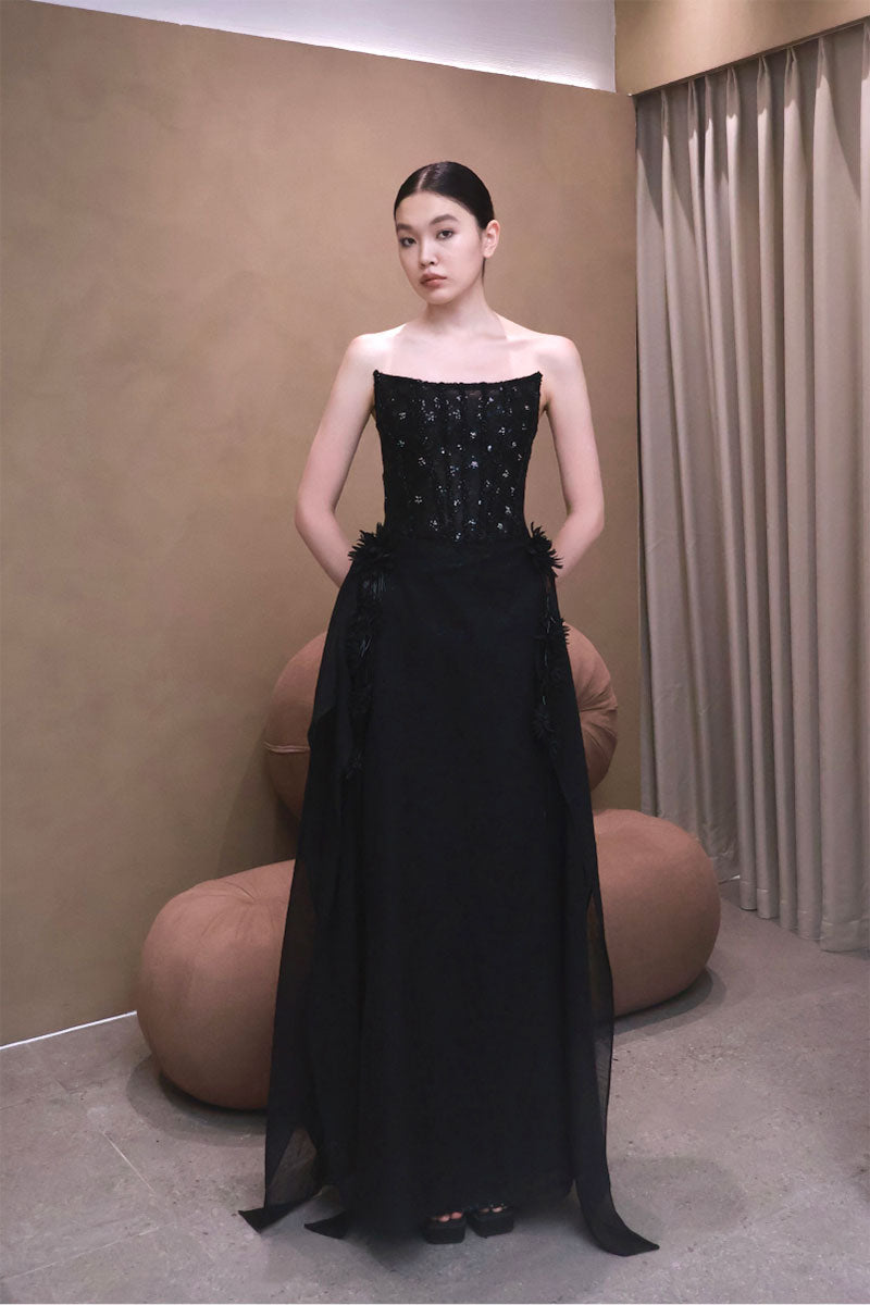 Elegant VESARA gown by EEGEN STUDIO, featuring flowing fabric and intricate details, perfect for formal occasions.