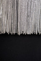 Elegant EEGEN STUDIO Kaya gown with intricate embroidery and flowing fabric, perfect for formal occasions.