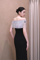 Elegant EEGEN STUDIO Kaya gown with intricate embroidery and flowing fabric, perfect for formal occasions.