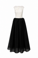 Elegant LINNEA gown by EEGEN STUDIO, featuring flowing fabric and intricate details, perfect for formal occasions.