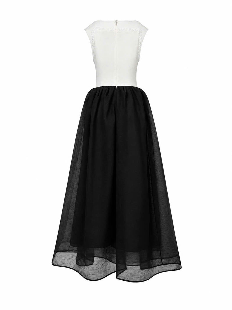 Black and white LINNEA gown by EEGEN STUDIO, elegant long dress with flowing fabric and subtle design details.
