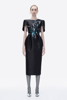 Hand-painted black Luminous Secret midi dress by Tiny Ink, showcasing elegant length and artistic design details.