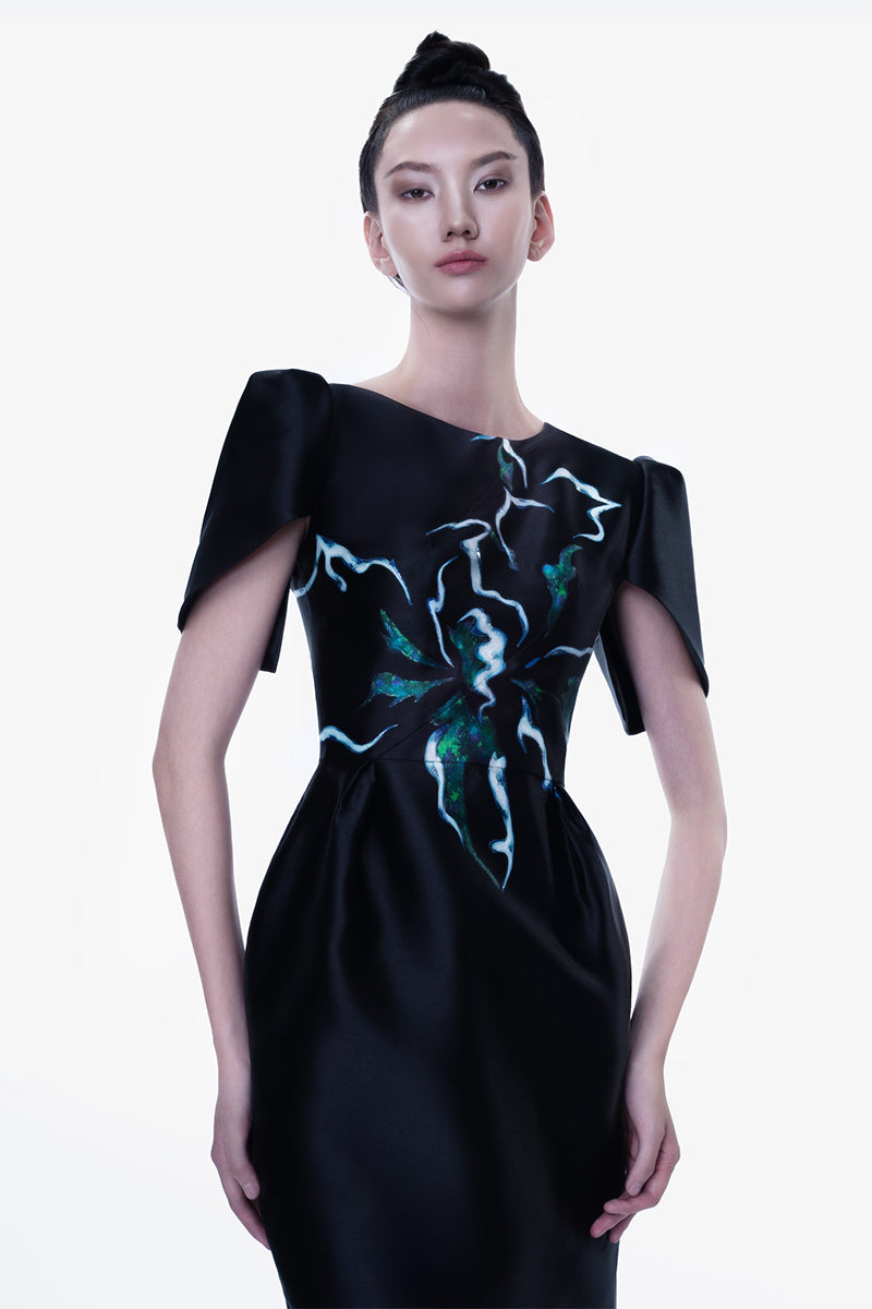 Hand-painted black Luminous Secret Midi Dress by Tiny Ink, showcasing intricate design and elegant midi length.