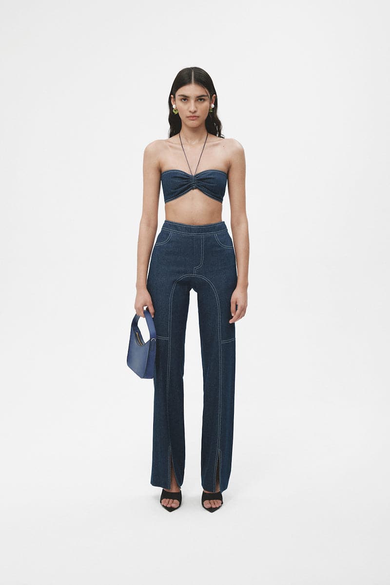 Navy blue denim biker pants by JC Pajares featuring a fitted design, classic five-pocket style, and stylish stitching details.