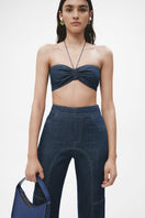 Navy blue denim biker pants by JC Pajares featuring a fitted design and classic denim texture.