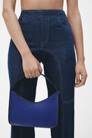 Navy blue denim biker pants by JC Pajares, stylish slim-fit pants with rugged stitching and classic five-pocket design.