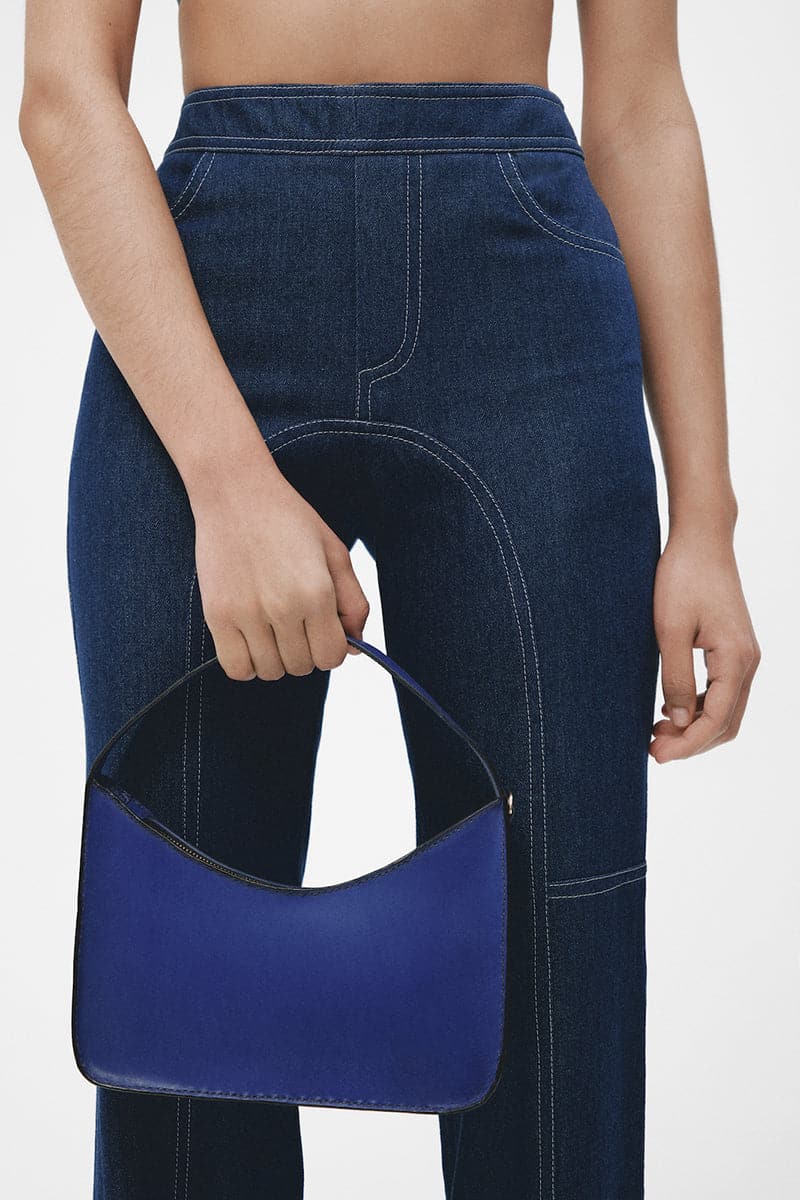 Navy blue denim biker pants by JC Pajares, stylish slim-fit pants with rugged stitching and classic five-pocket design.