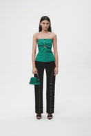 Black long pants with eyelet details from JC Pajares, featuring a relaxed fit and modern style.