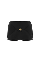 Black POEM Marabel mini skirt styled with casual top, showcasing a trendy, fitted mini skirt silhouette.