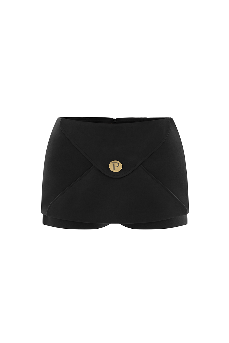 Black POEM Marabel mini skirt styled with casual top, showcasing a trendy, fitted mini skirt silhouette.