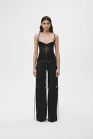 Black lingerie top from JC Pajares, featuring delicate lace details and a fitted design, displayed on a white background.