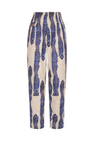 DUMA&CO MANTO Pants in neutral fabric, showing the fit and design details on a mannequin.
