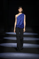 Stylish JC Pajares pants with chain accents, featuring a modern runway-inspired design and a fashionable, edgy look.