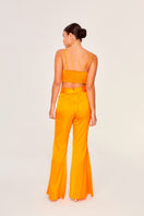 Aguaclara Papaya bustier top featuring vibrant fabric, fitted design, and fashionable style suitable for summer wear.