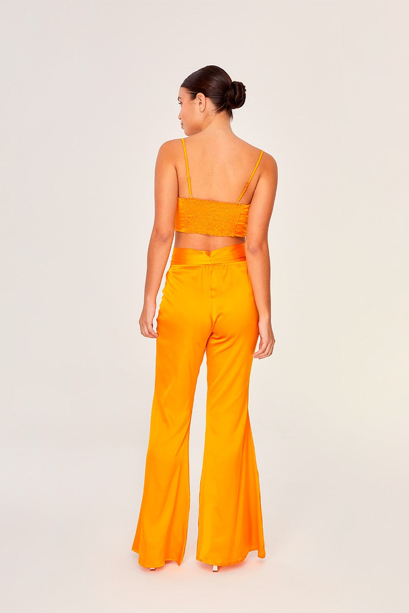 Aguaclara Papaya bustier top featuring vibrant fabric, fitted design, and fashionable style suitable for summer wear.