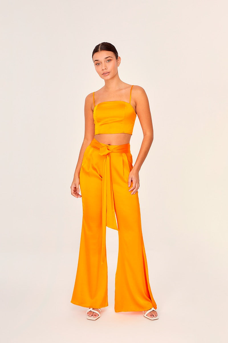 Aguaclara Papaya bustier top in vibrant orange with fitted design and adjustable straps, styled on a mannequin.
