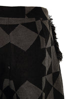 Pattern baggy trousers by MAZ Manuela Álvarez featuring a loose fit and bold geometric pattern, shown on a model.