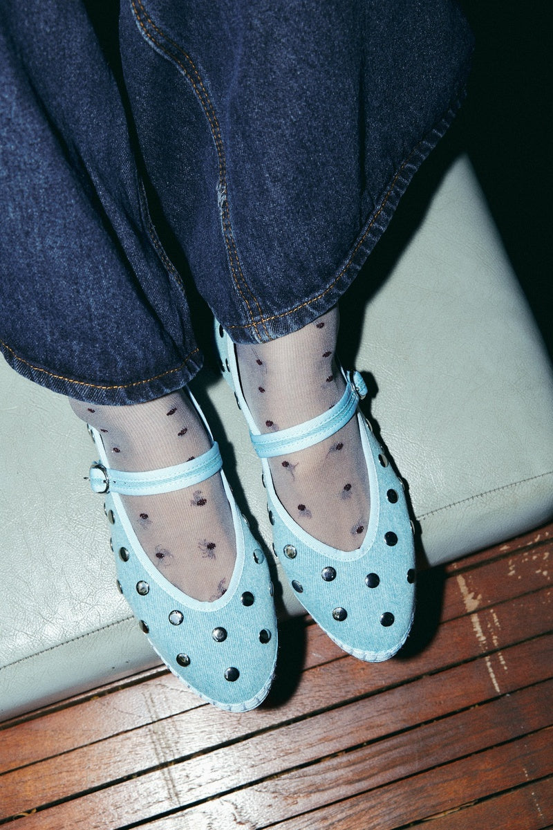Flabelus Mae Silver Light Denim Flats showing a casual slip-on style with light denim fabric and a rounded toe.