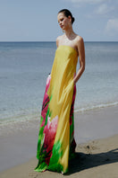 Sisters Peony Dress in bold blossom print, a stylish maxi dress with vibrant floral design and flowing fabric.