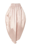 Pastel pink peony maxi skirt by Studio NK, flowing fabric with a floral-inspired design, perfect for elegant, feminine style.