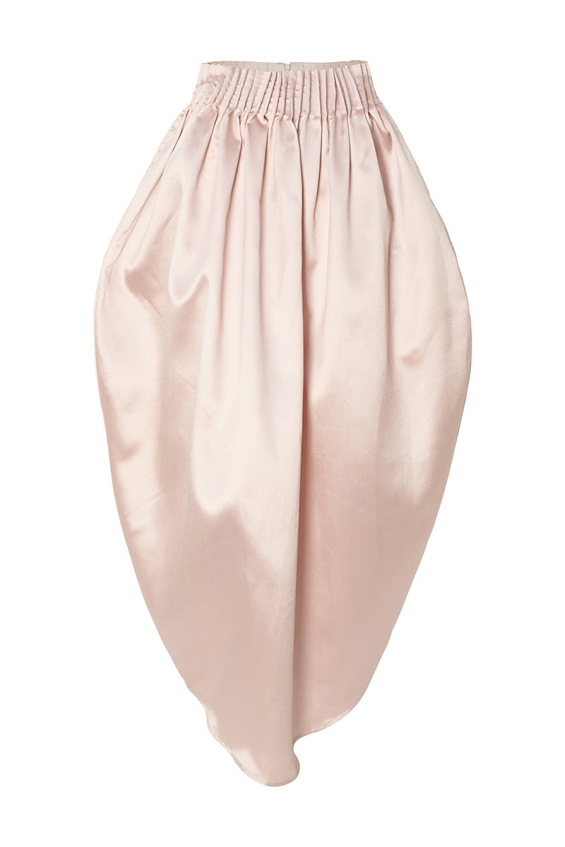 Pastel pink peony maxi skirt by Studio NK, flowing fabric with a floral-inspired design, perfect for elegant, feminine style.