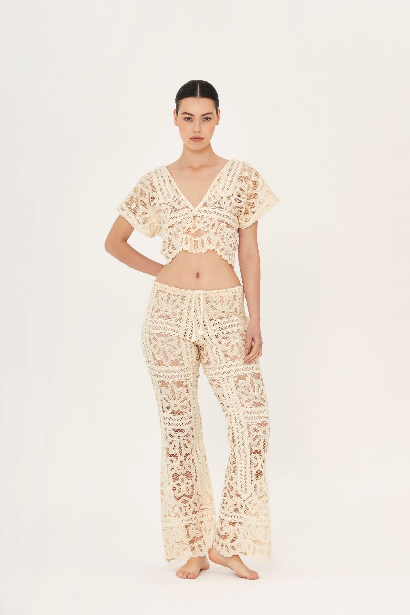 Aguaclara La Perle crop top in soft fabric, featuring a stylish neckline and fitted design, perfect for casual wear.