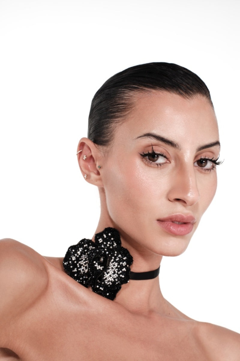 Nué Black Orchid Crystal Choker necklace featuring sparkling crystals and a sleek black design, perfect for elegant style.