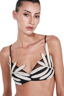 Nué Palme Black Leaf Bralette top with a leaf pattern, featuring adjustable straps and a comfortable fit.