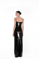 Nué Bare Black Sequin Gown showcasing elegant design and shimmering sequins, perfect for formal occasions.