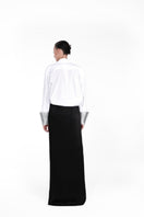 Nué mirror shirt, stylish button-up shirt with reflective mirror accents, displayed on a hanger.