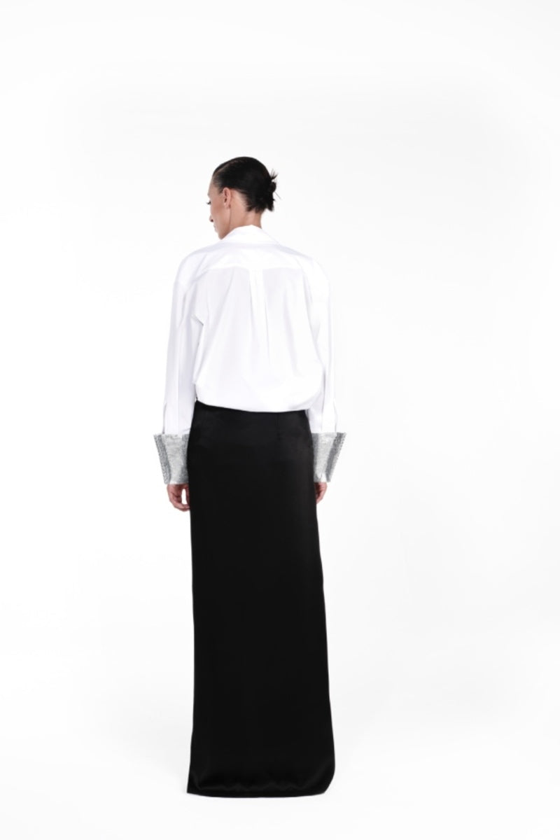 Nué mirror shirt, stylish button-up shirt with reflective mirror accents, displayed on a hanger.