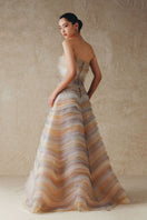 Elegant Phan Huy A-line sheer tulle gown with flowing skirt and delicate fabric, perfect for formal occasions.