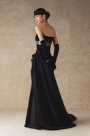 Black gown with hand-embroidered white bead details on the mid-waist, elegant Phan Huy evening wear.