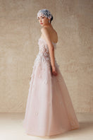 Elegant A-line sheer tulle gown by Phan Huy with hand-embroidered beads, flowing skirt and delicate details.