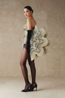 Mini mesh fabric dress with embroidered curves by Phan Huy, showcasing a fitted design and intricate embroidery details.